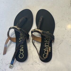 Calvin klein brown and black monogrammed sandles with gold toned hardware